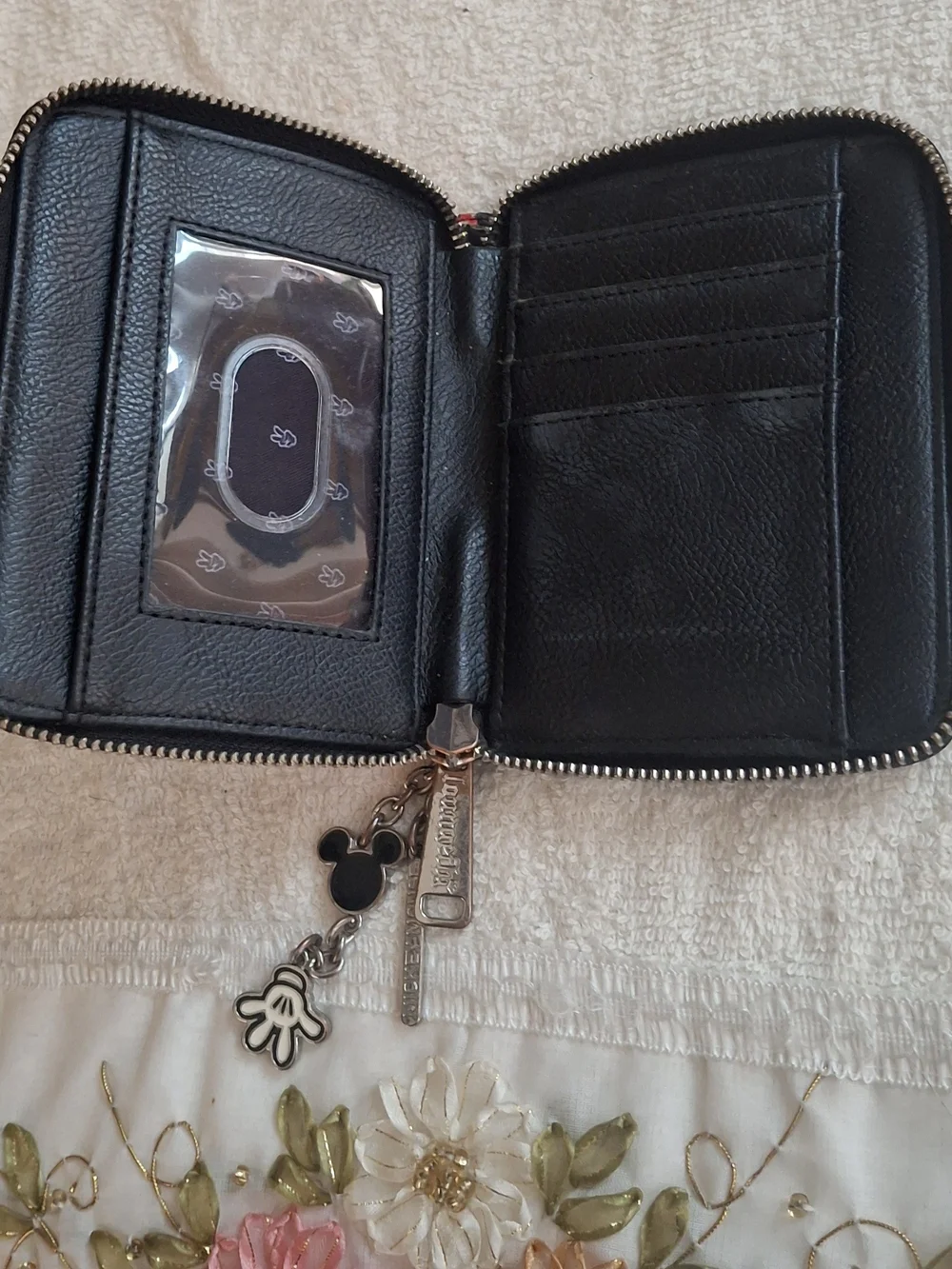 Disney Loungefly zip-around wallet featuring a white Mickey Mouse gloved hand